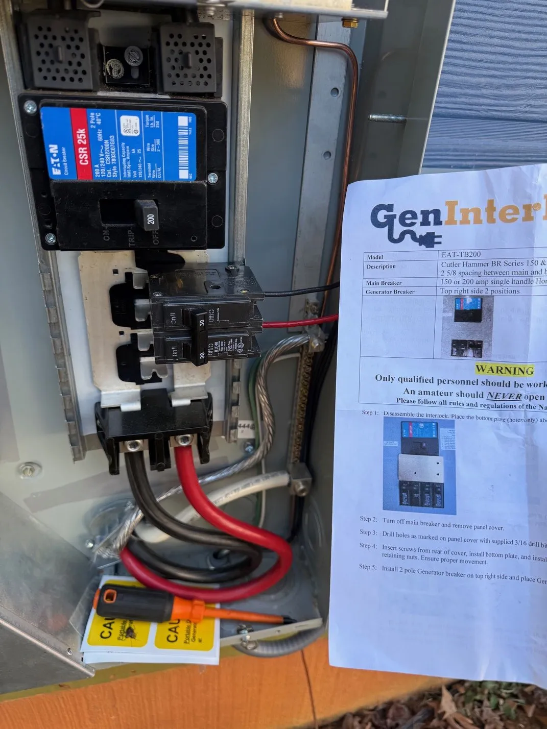 Panel with a generator interlock kit and a 200 amp main breaker