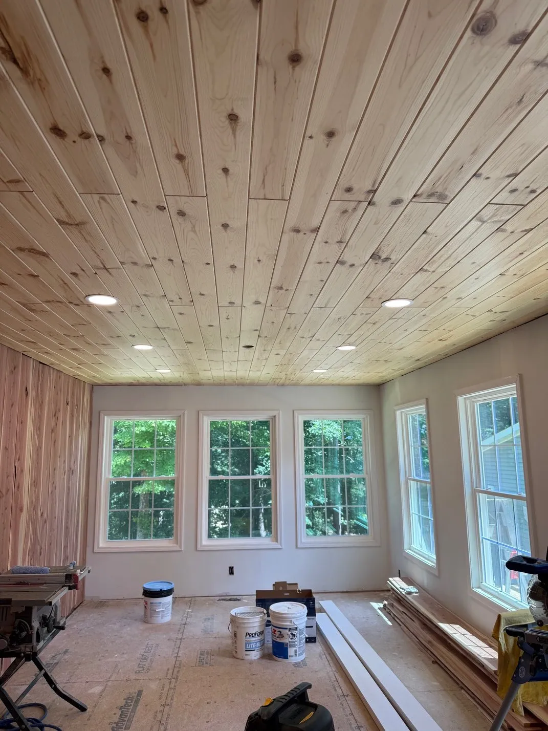 Remodeled sunroom with a pine ceiling and recessed lights
